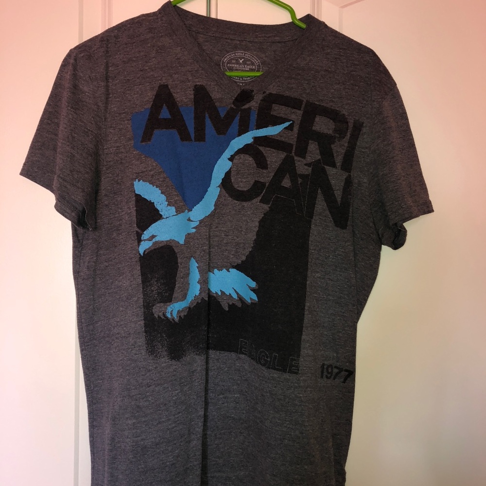 Grey shirt.